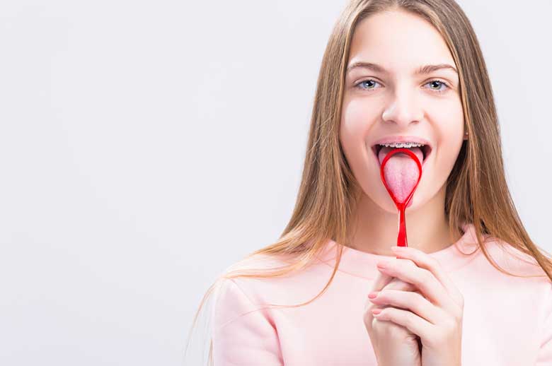 Girl Brushing her tongue